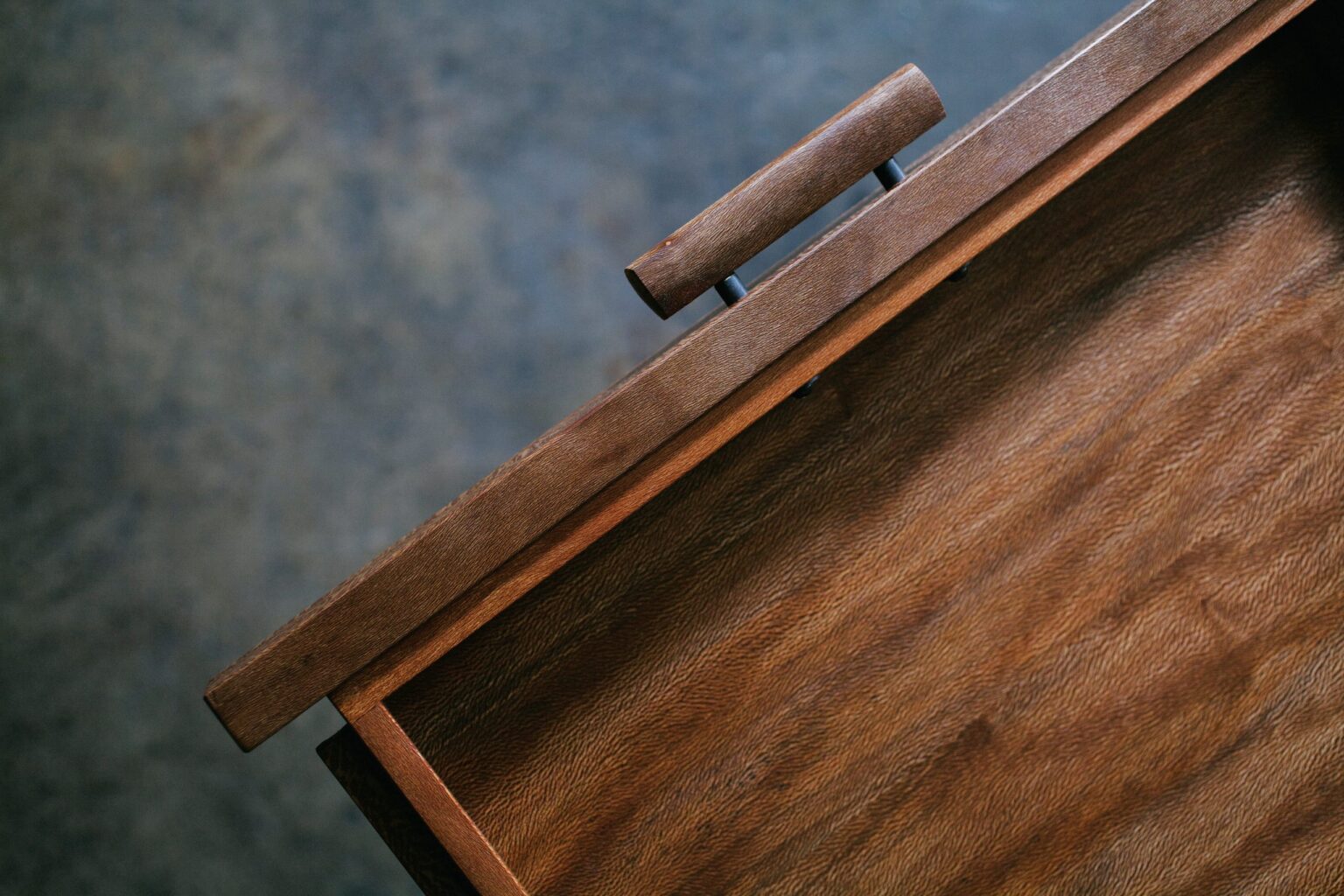 Detail of the grain and structure of a wooden piece of furniture.